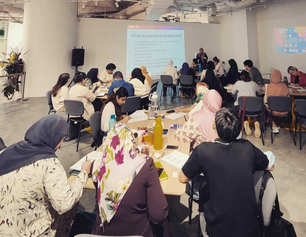Volunteers attending a children's development awareness talk
