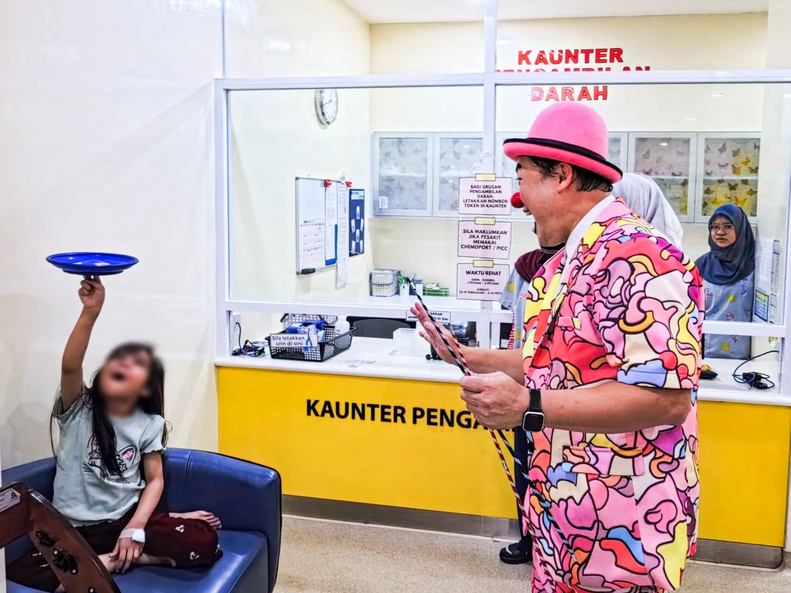 Caring Clown bringing joy to a child at the hospital