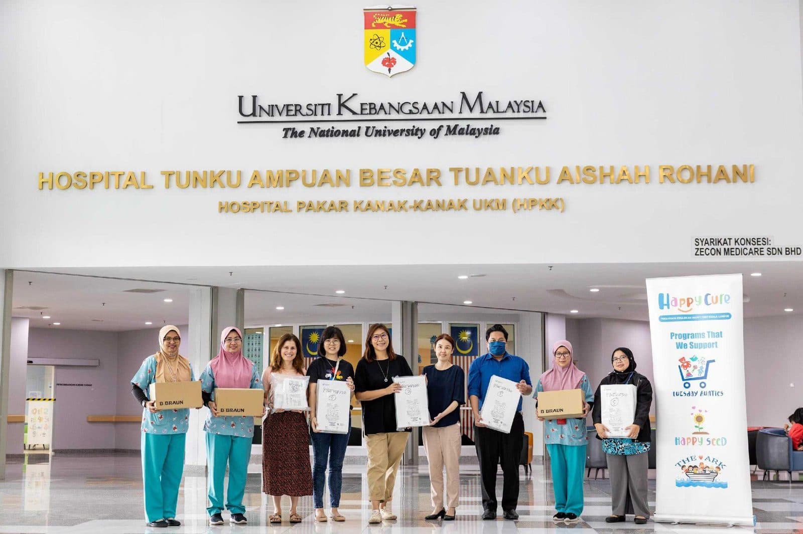 Happy Cure team handing over medical equipment sponsorship at HPKK UKM